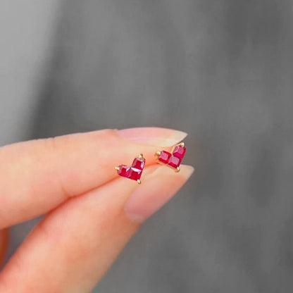 0.35ct ruby by heart earrings 18k gold on hand