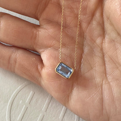 love more bezel ceylon blue sapphire necklace in 18K gold on hand