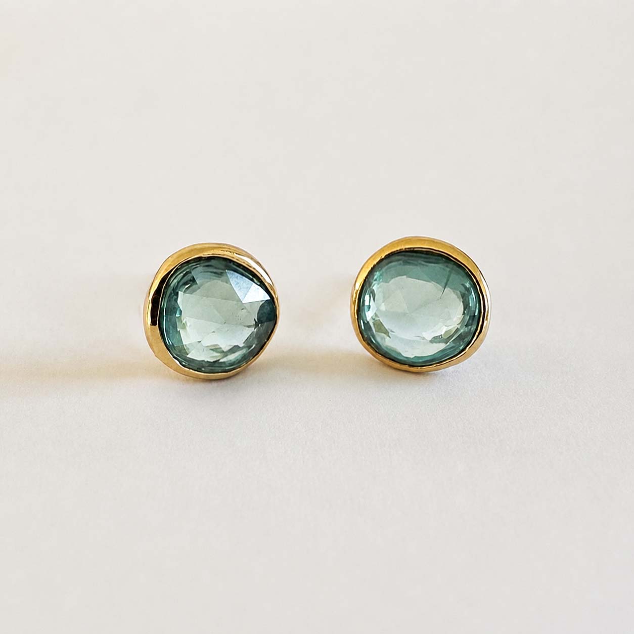 love more green sapphire earrings in 18k gold front view