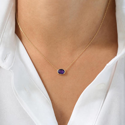 love more bezel set oval purple sapphire necklace in 18k gold on model
