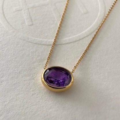 love more bezel set oval purple sapphire necklace in 18k gold close up