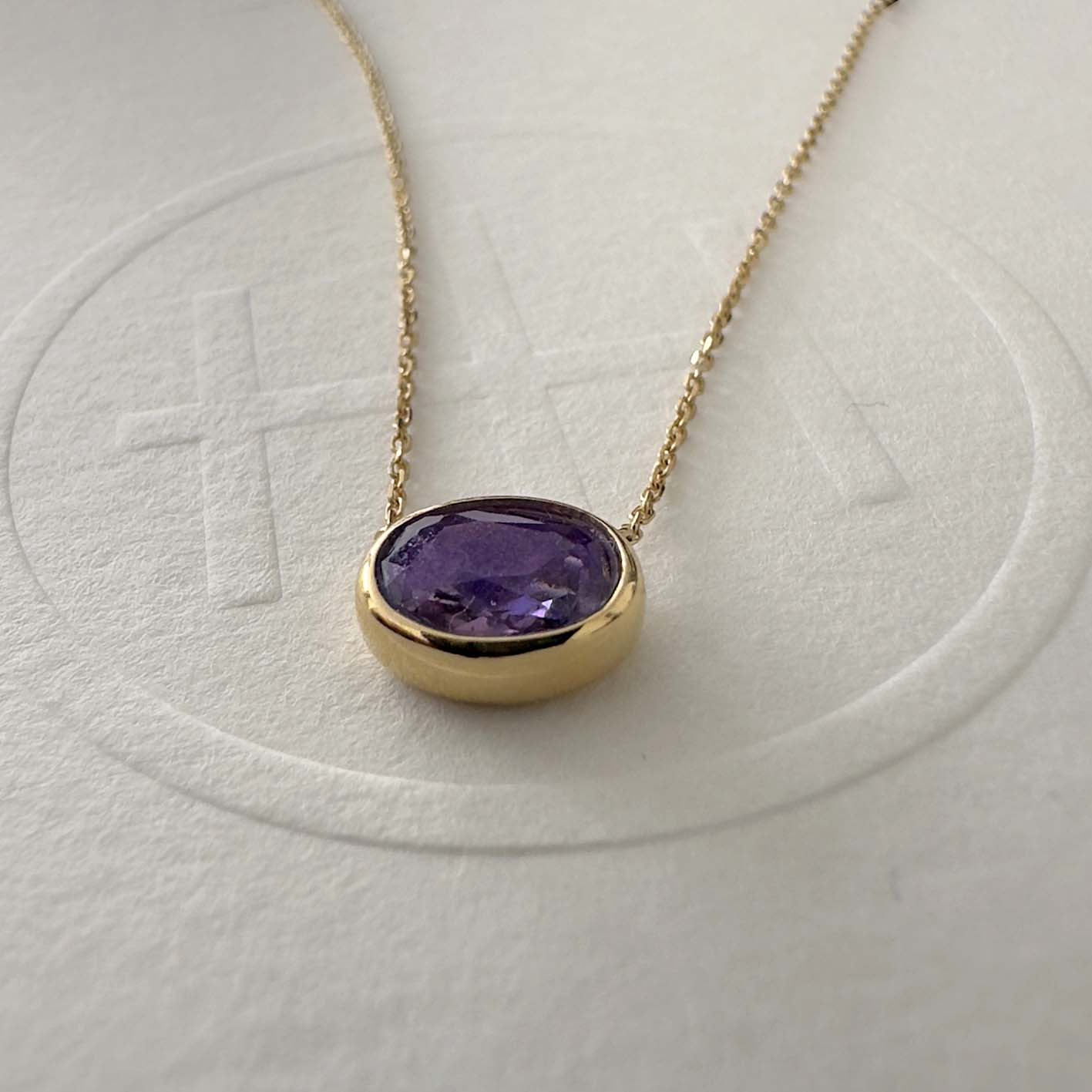 love more bezel set oval purple sapphire necklace in 18k gold side view