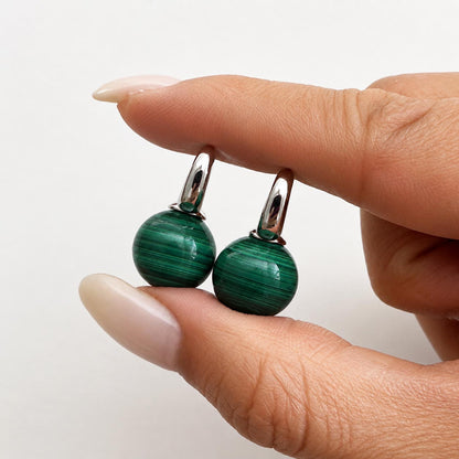 jullie green malachite ball earrings in sterling silver on hand