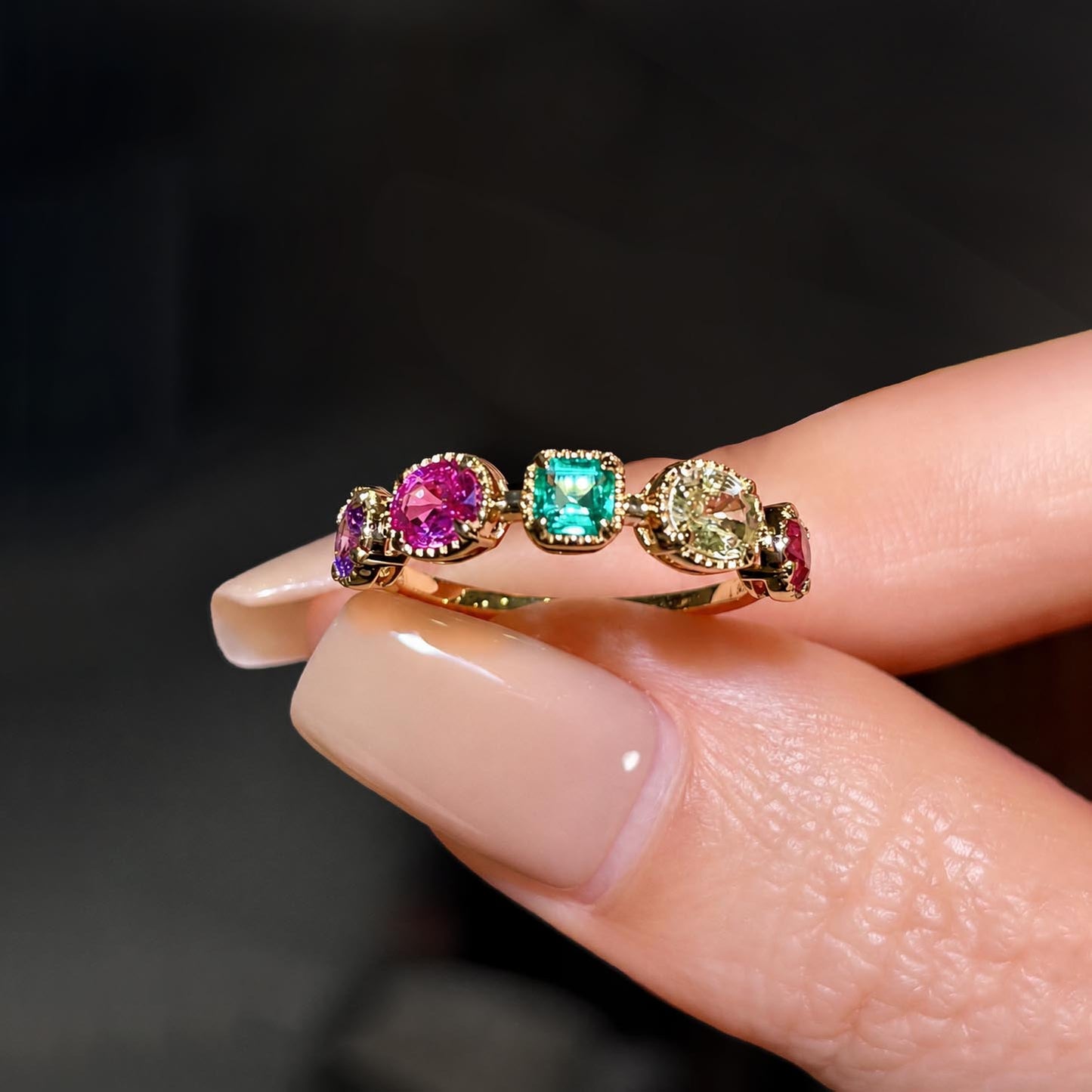 mixed cut colored gemstones ring in 18k gold front view