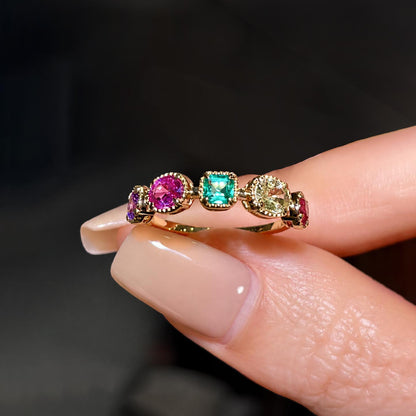 mixed cut colored gemstones ring in 18k gold front view