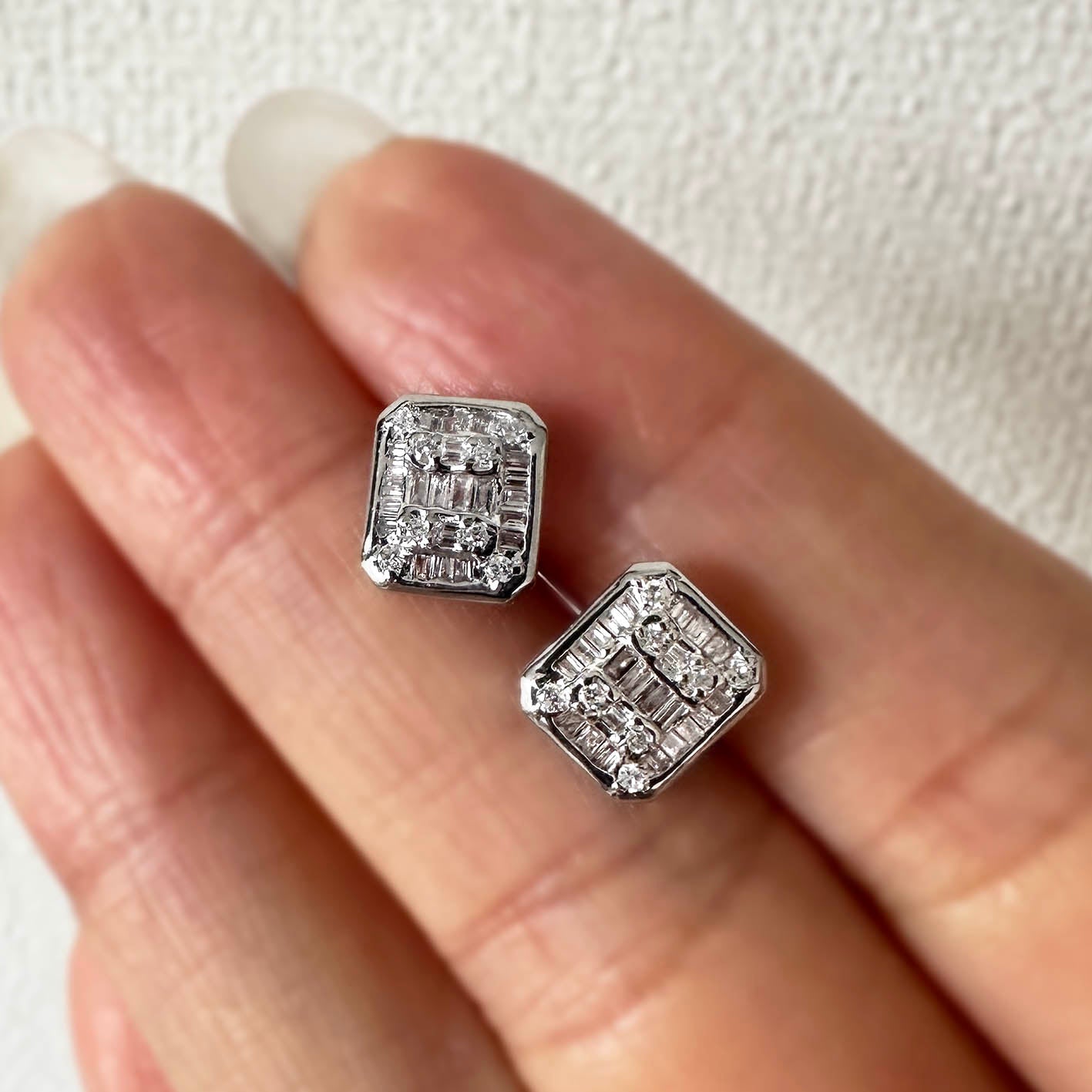 ooak 0.46ct emerald shape diamond cluster earrings in 18k white gold on hand