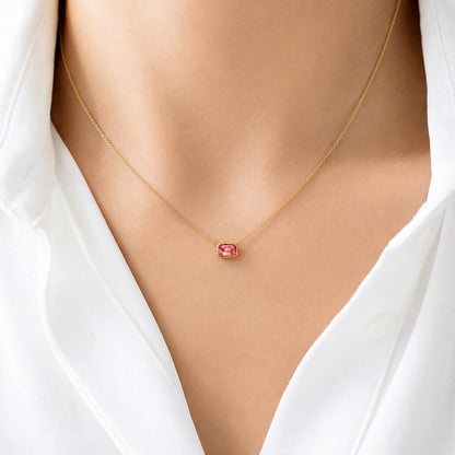 ooak bezel set padparadscha sapphire necklace in 18k gold on model