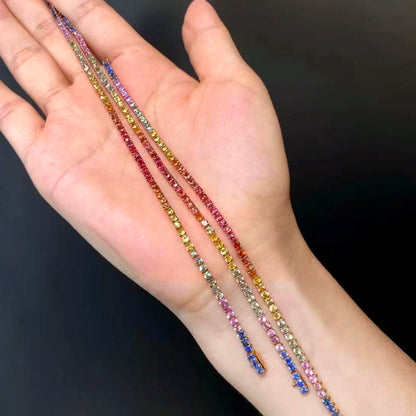 one of a kind rainbow sapphire bracelet in 18k gold on hand