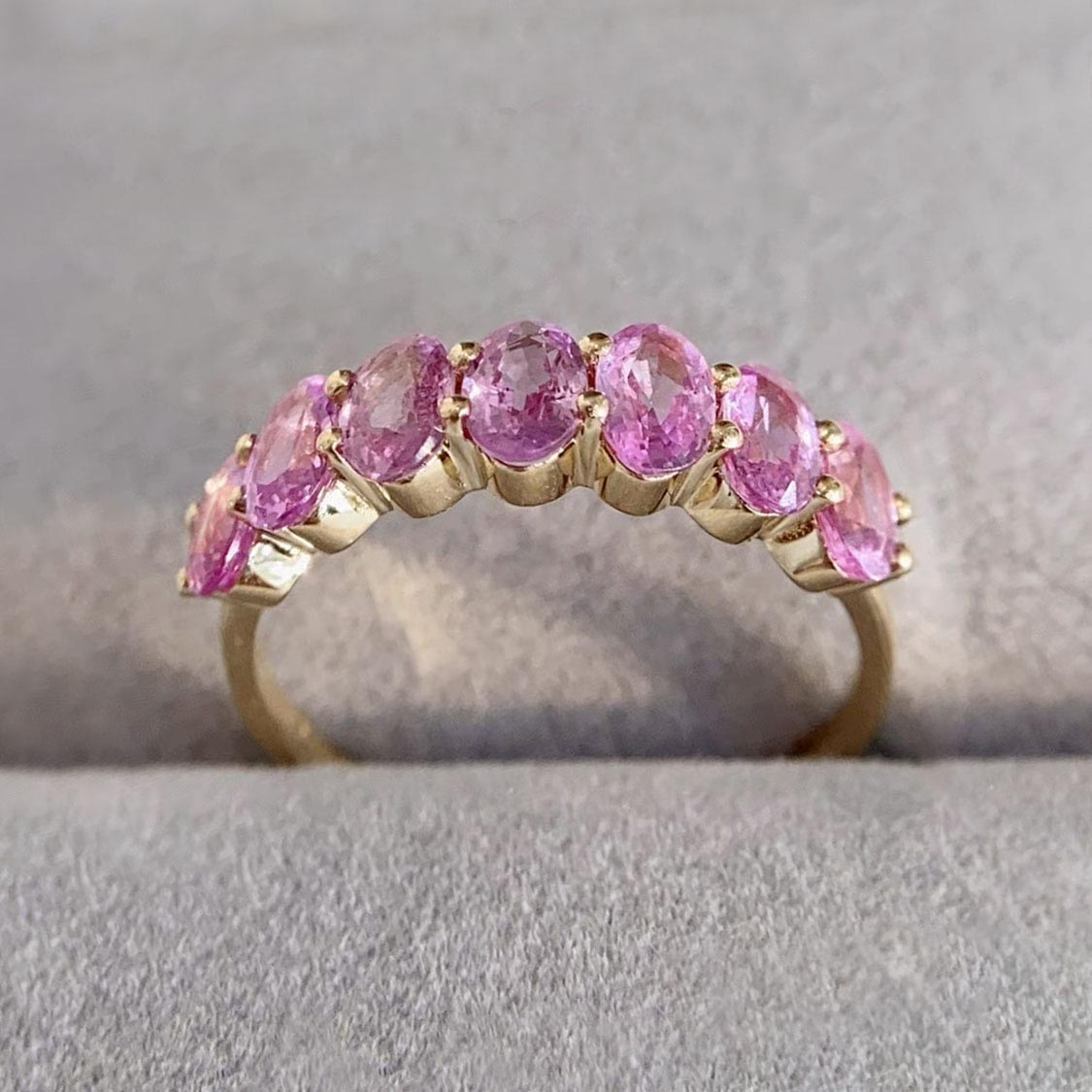 seven stone oval pink sapphire ring in 18k gold