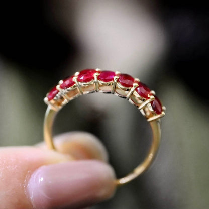 seven stone oval ruby ring in 18k gold side view