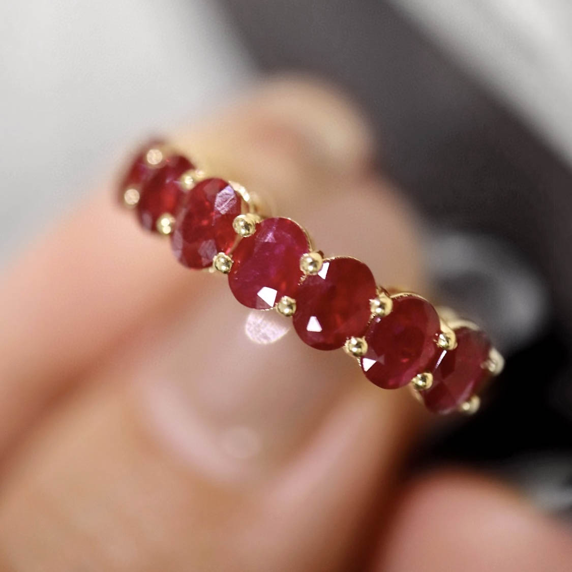 seven stone oval ruby ring in 18k gold