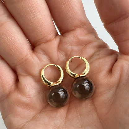 jullie smoky quartz ball earrings in 18k gold plated sterling silver on hand