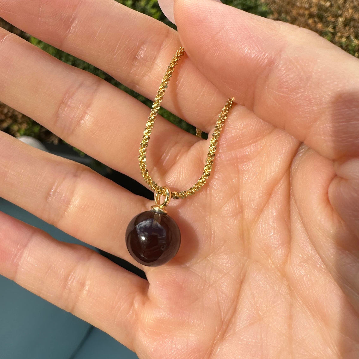 jullie smoky quartz ball necklace in 18k gold plated sterling silver on hand