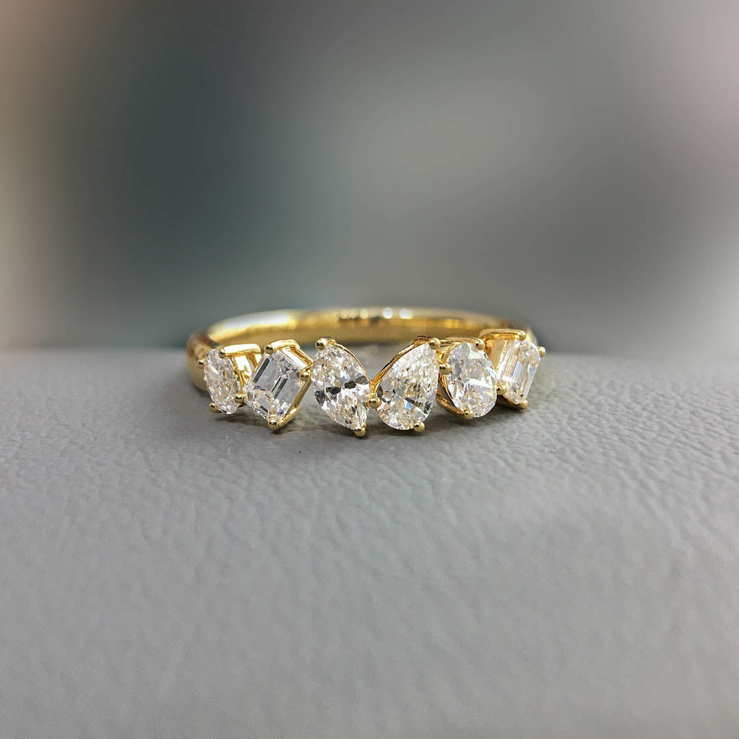 tiede fancy cut diamond ring in 18k gold on table