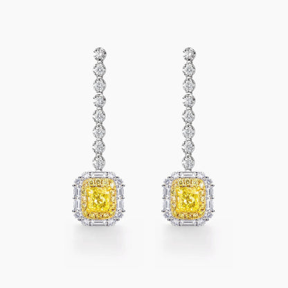 yellow diamond emerald shape earrings in 18k white gold