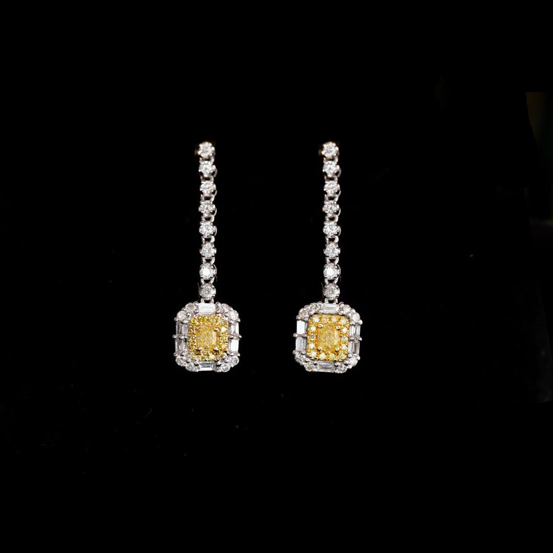 yellow diamond emerald shape earrings in 18k white gold