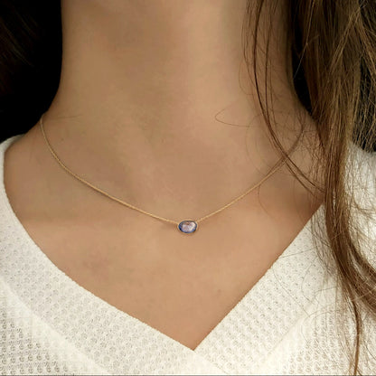 blue sapphire necklace 18k gold on neck