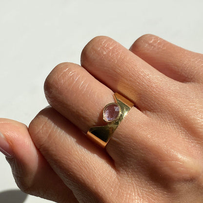 pink sapphire cigar ring 18k gold on finger