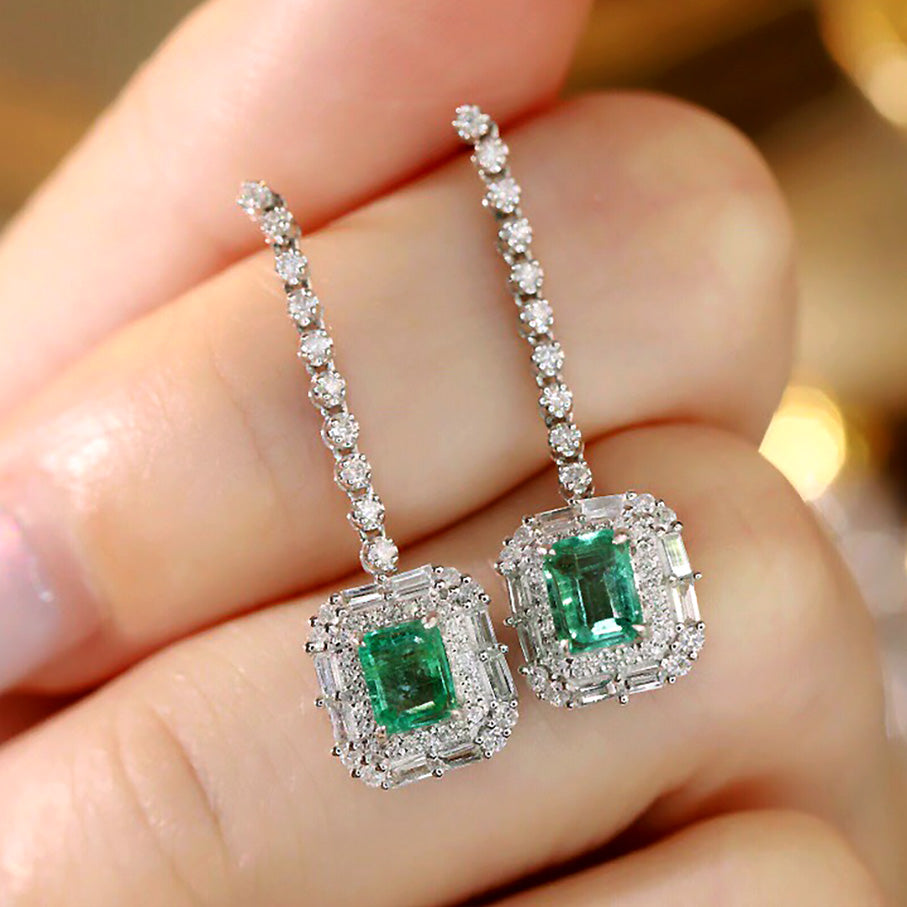 emerald diamond earrings 18k white gold on hand