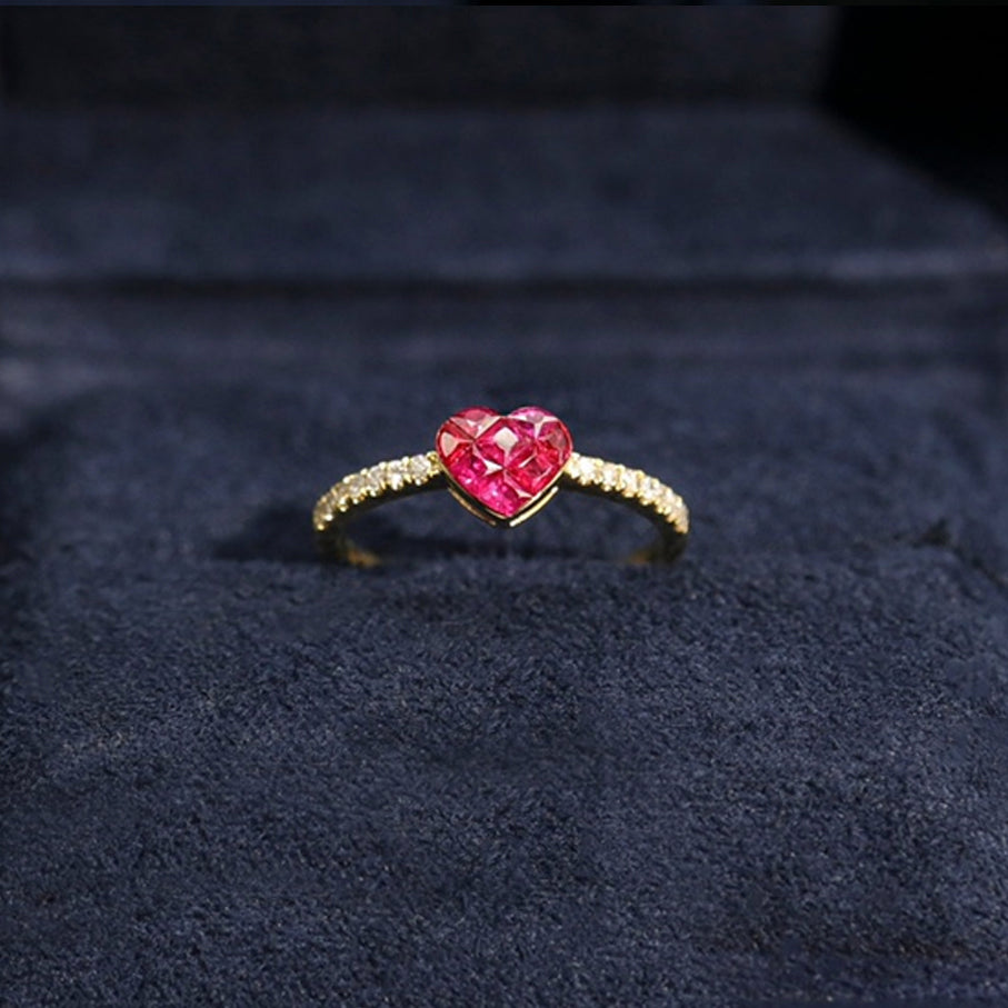 0.5ct ruby by heart diamond ring 18k gold on table