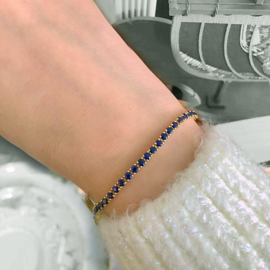 blue sapphire bracelet 18k gold on arm