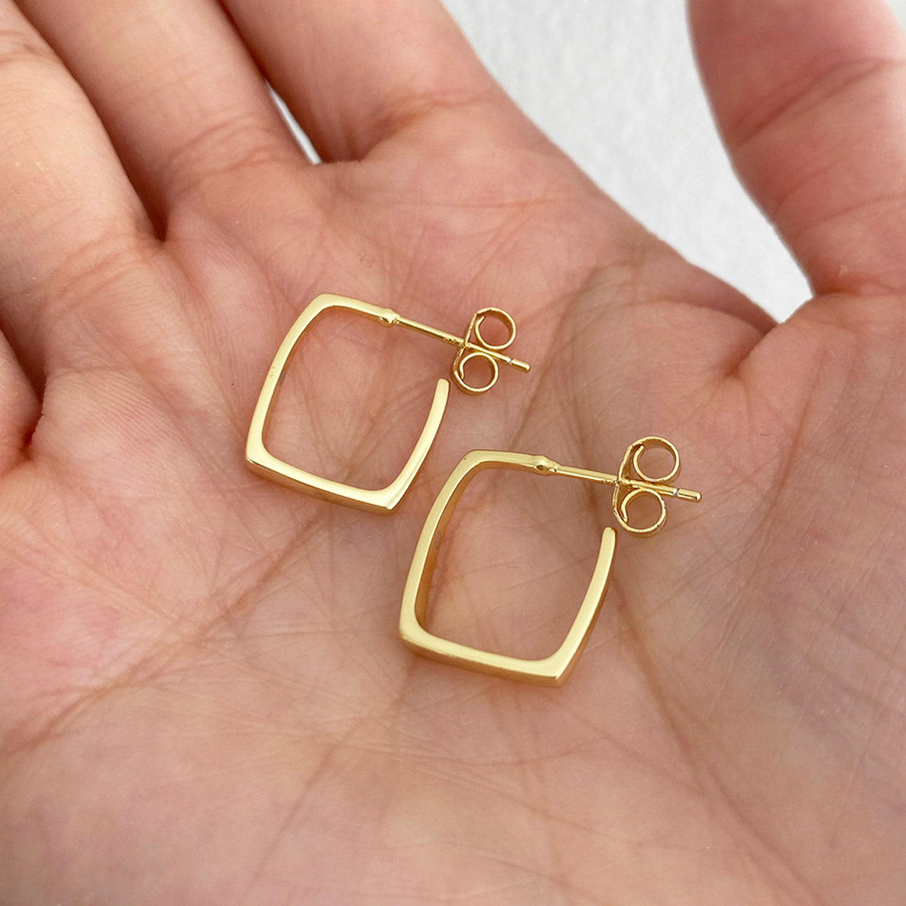 square earrings 18k gold plated sterling silver on hand