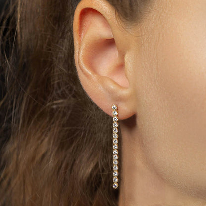 1.0ct disco diamond tennis earrings in 18k gold on ear